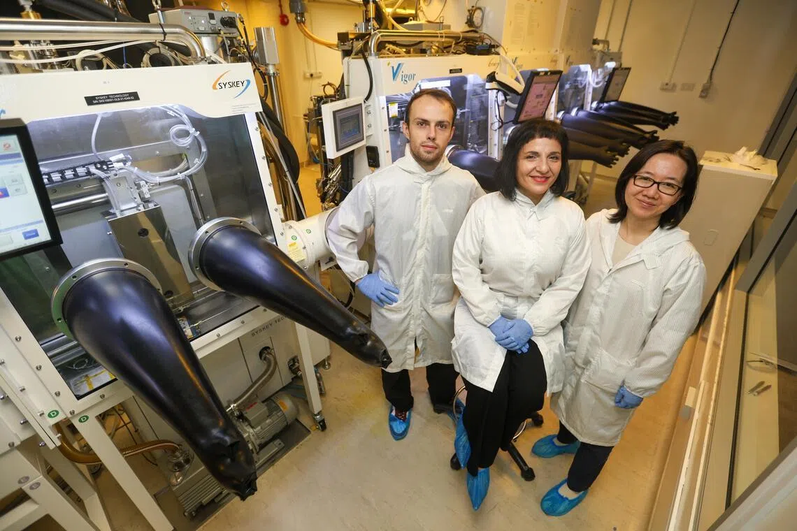 NTU researchers Edoardo Albanesi, Annalisa Bruno, and Herlina Dewi in the laboratory at the Energy Research Institute @ NTU.