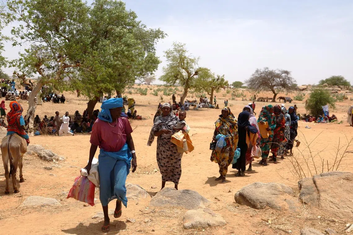 Refugees waiting to receive rations from the World Food Programme, near the border between Sudan and Chad, on May 9, 2023.