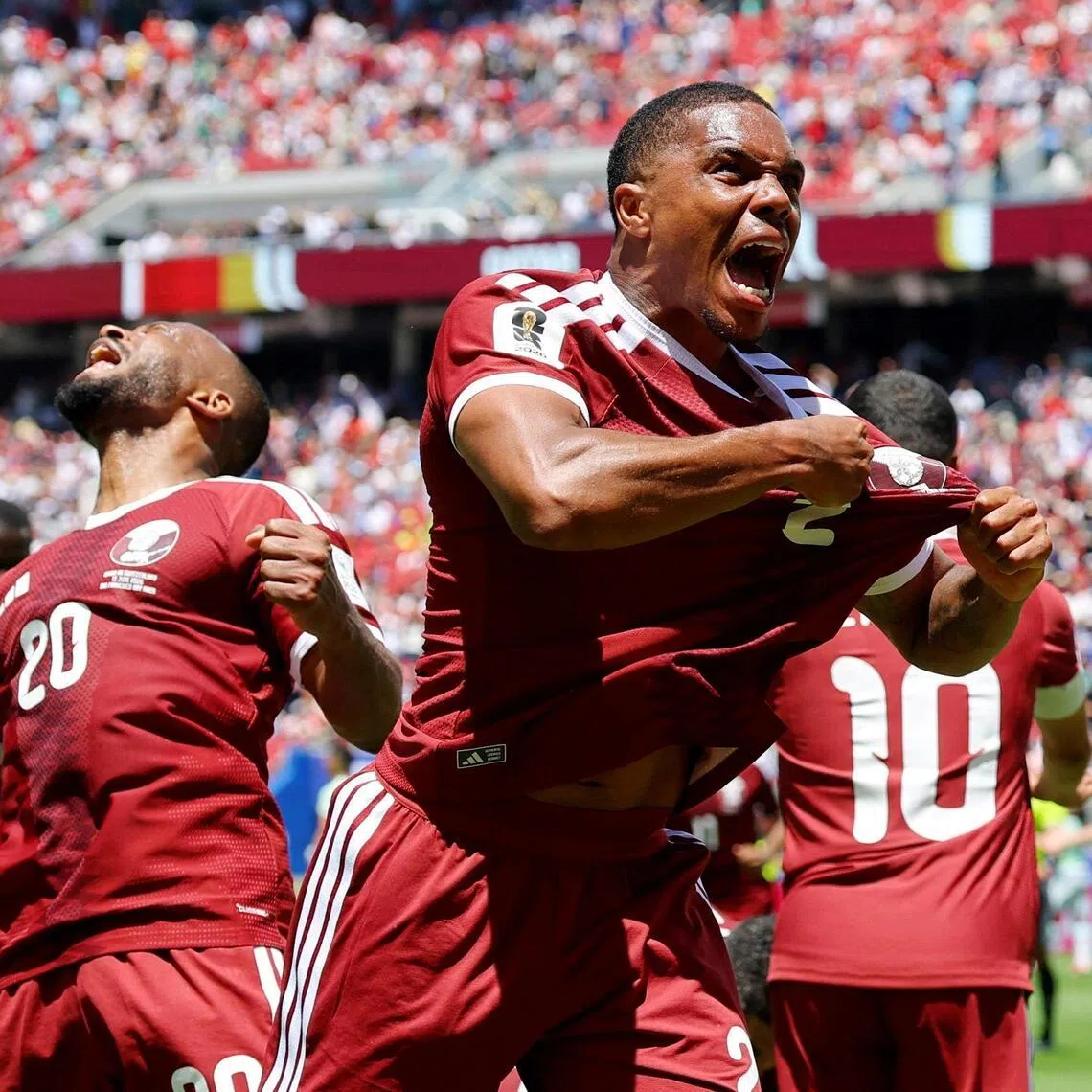 Qatar's Pedro Miguel celebrating after Boualem Khoukhi scored the equaliser against Switzerland four minutes into injury time.