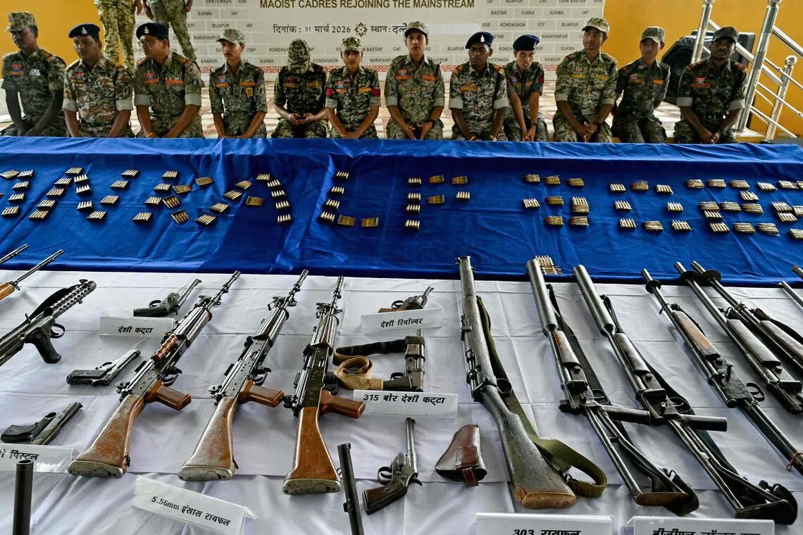 Weapons seized from Maoist rebels and fighters upon their surrender are displayed at a police facility in Dantewada in Chhattisgarh state's Bastar division on March 31.