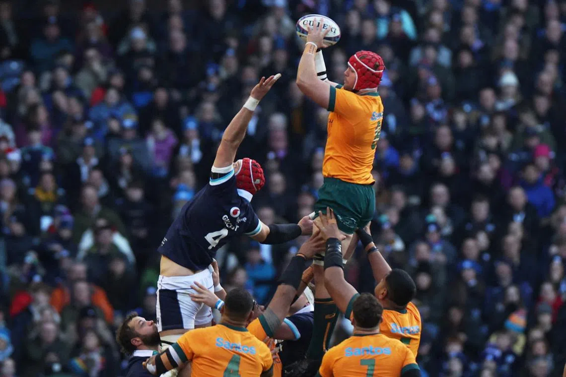 FILE PHOTO: Rugby Union - Autumn Internationals - Scotland v Australia - Scottish Gas Murrayfield Stadium, Edinburgh, Scotland, Britain - November 24, 2024  Australia's Harry Wilson in action with Scotland's Grant Gilchrist REUTERS/Russell Cheyne/File Photo