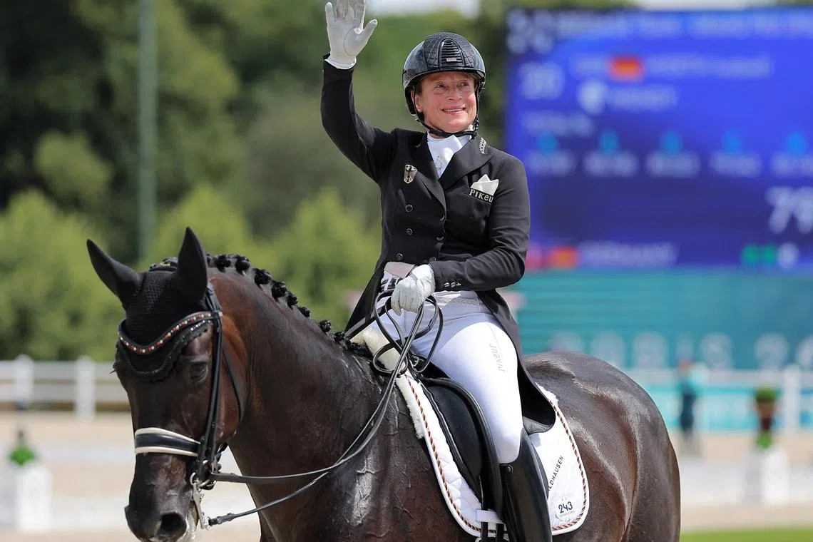 Paris 2024 Olympics - Equestrian - Dressage Team Grand Prix Special - Chateau de Versailles, Versailles, France - August 03, 2024. Isabell Werth of Germany riding Wendy reacts after competing. REUTERS/Zohra Bensemra
