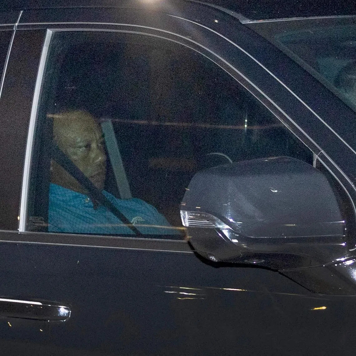Tiger Woods being driven from the Martin County Jail after being arrested following a car crash.
