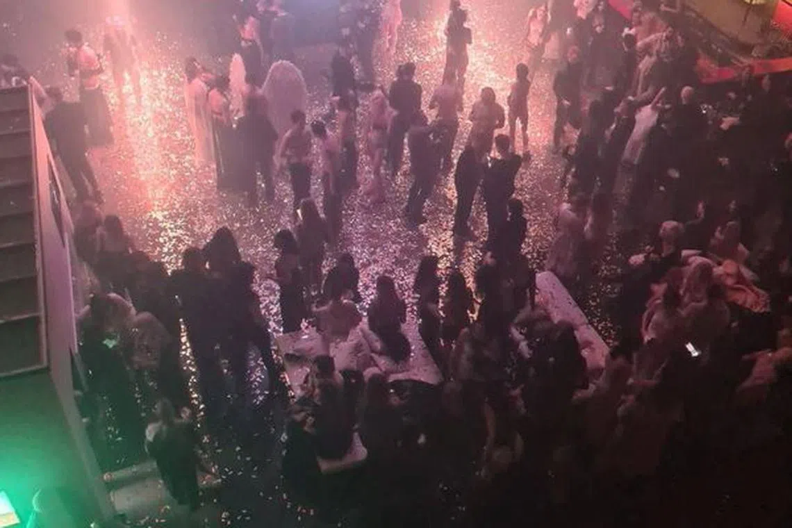 People attend an \"almost naked\" party organized by Russian blogger Anastasia (Nastya) Ivleeva at Mutabor nightclub in Moscow, Russia, in this image published December 21, 2023. Ostorozhno Novosti via REUTERS