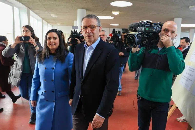 Presidential candidate Antonio Jose Seguro (right) and his wife Margarida Maldonado Freitas leave after voting in Caldas da Rainha, Portugal, on Feb 8.