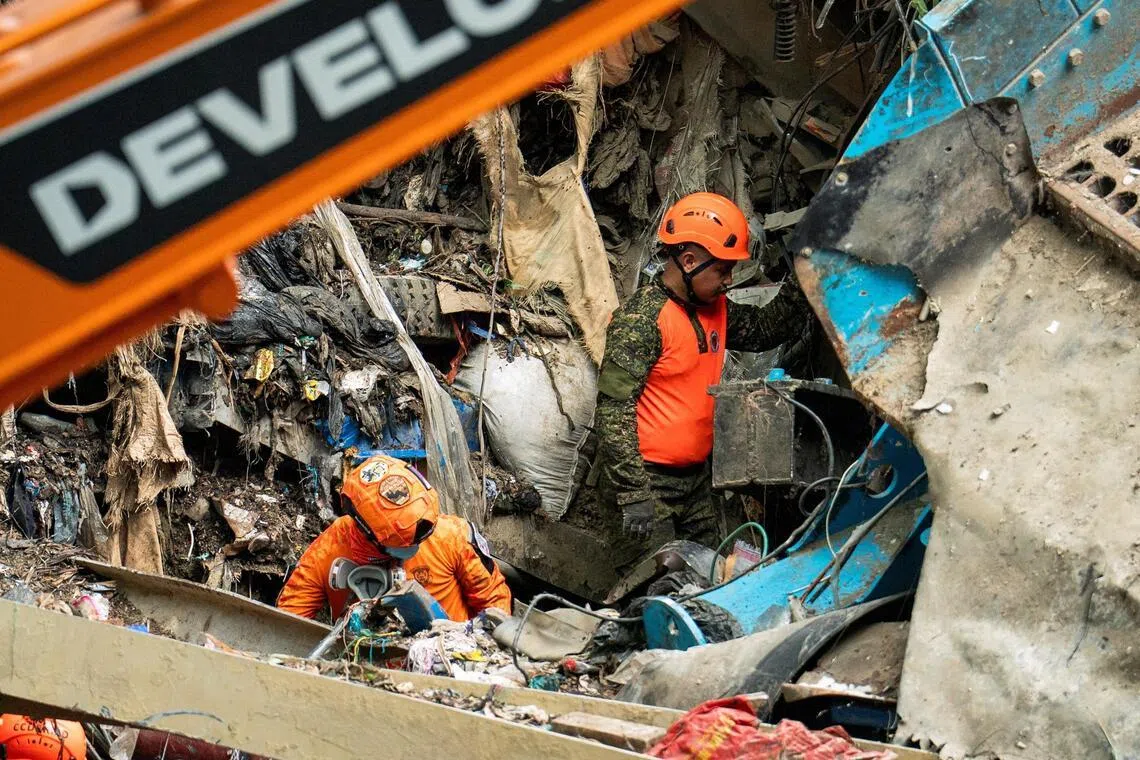 ‘Racing against time’: Death toll up as search goes on for survivors in Philippine dump site collapse