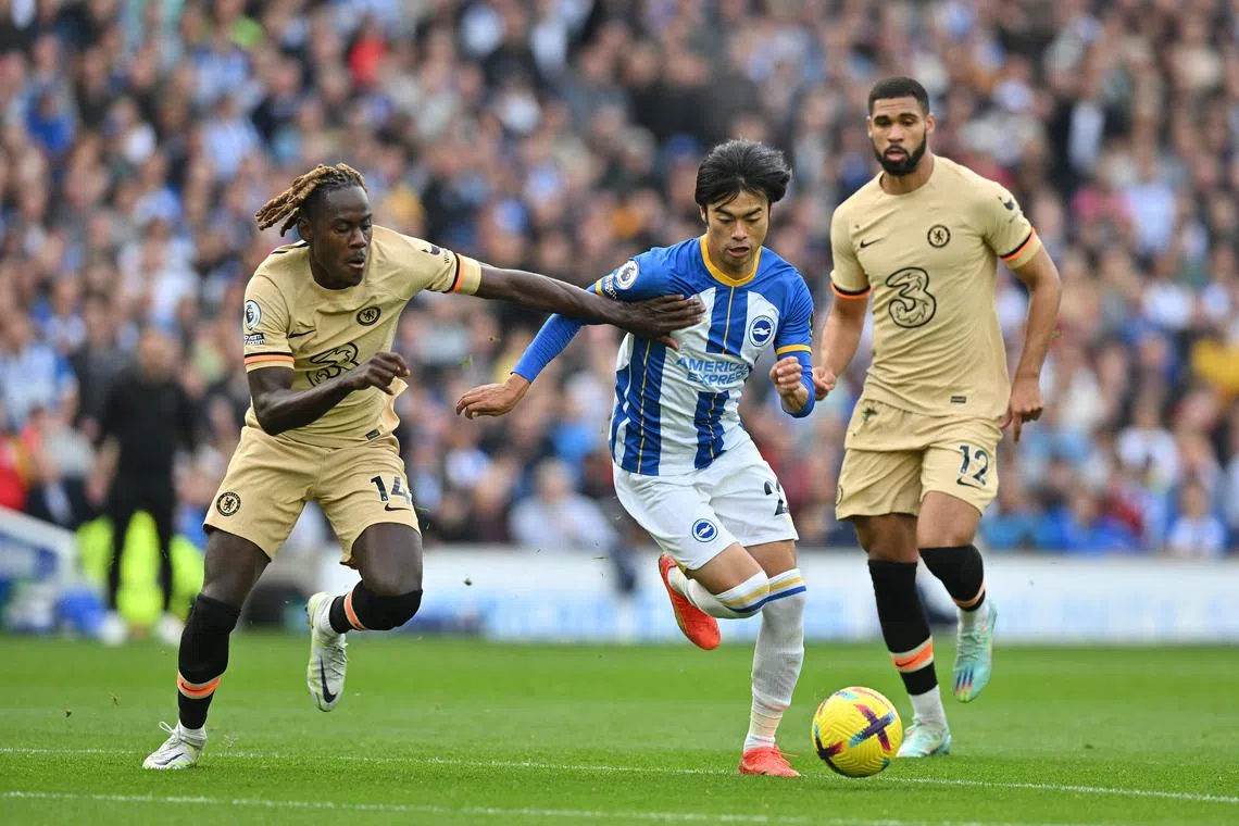 Brighton's Japanese ace Kaoru Mitoma (centre) speeds past Chelsea defender Trevoh Chalobah during his first EPL start on Oct 29.
