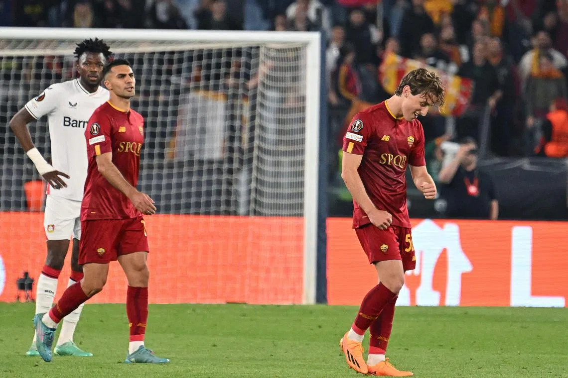 AS Roma's Italian midfielder Edoardo Bove (right) celebrates after scoring the opening goal.