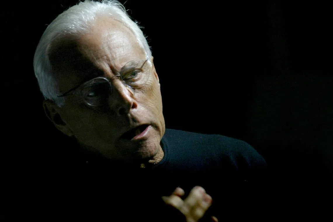 FILE PHOTO: Italian designer Giorgio Armani gestures before the start of his Autumn/Winter 2004 women's collection during Milan Fashion Week, Italy, February 23, 2004. REUTERS/Alessandro Bianchi/File Photo