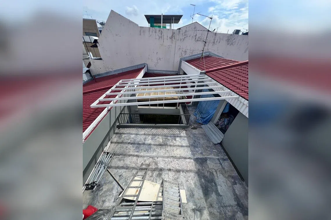 Mr Ng removed a portion of the building roof and the roof gutter, built an open terrace and installed a roofing frame. 
