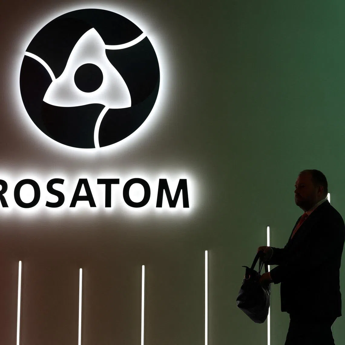 A participant walks past an exhibition stand of Russia's State Atomic Energy Corporation Rosatom at the Russian Energy Week international forum in Moscow, Russia, October 15, 2025. REUTERS/Ramil Sitdikov
