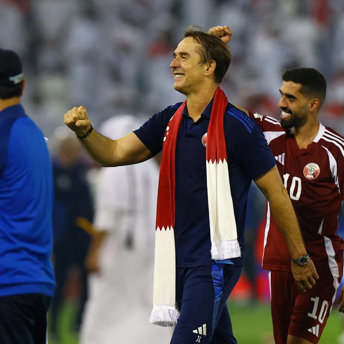 FILE PHOTO: Soccer Football - FIFA World Cup - AFC Qualifiers - Group A - Qatar v United Arab Emirates - Jassim Bin Hamad Stadium, Doha, Qatar - October 14, 2025 Qatar coach Julen Lopetegui celebrates with Hassan Al Haydos after qualifying for the FIFA World Cup REUTERS/Ibraheem Al Omari/File Photo