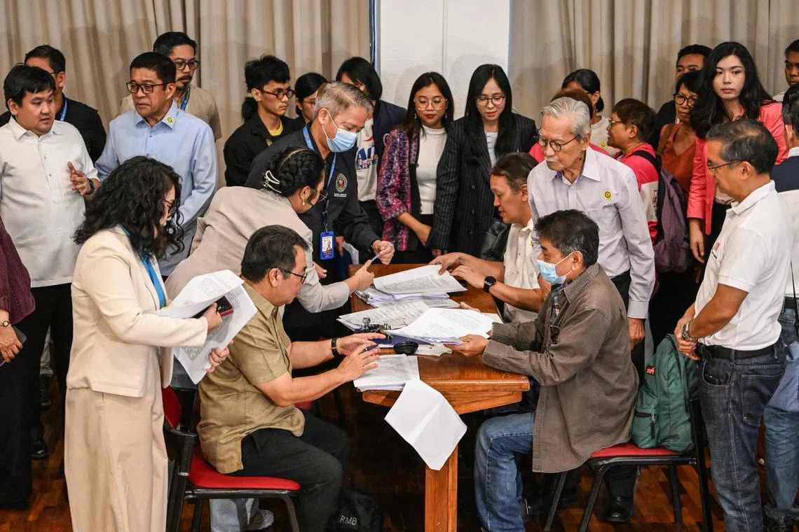 Members of progressive groups prepare to file a second impeachment complaint against Ms Sara Duterte at the House of Representatives in Quezon City.