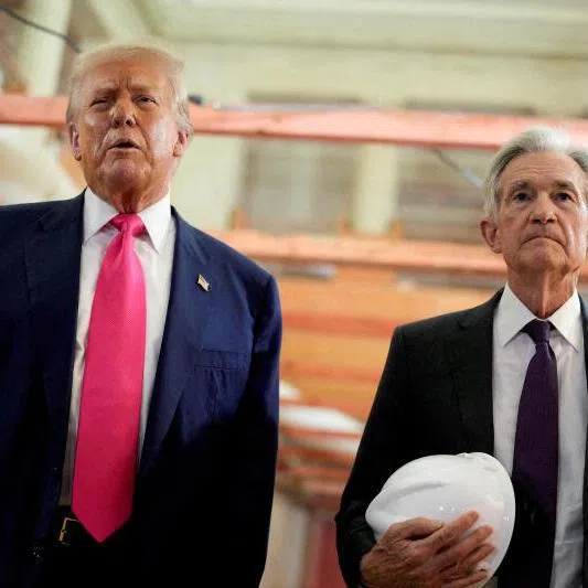 US President Donald Trump and Federal Reserve Chair Jerome Powell speak during a tour of the Federal Reserve Board building, which is currently undergoing renovations, in Washington DC.