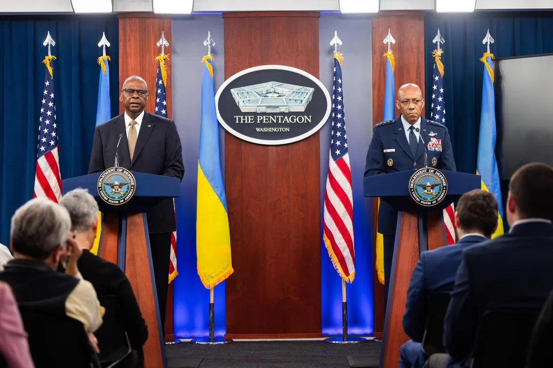 US Secretary of Defence Lloyd Austin (left) and Chairman of the Joint Chiefs of Staff Charles Brown speak about federal aid bound for Ukraine, as well the country's munition needs, at the Pentagon in Arlington, Virginia.
