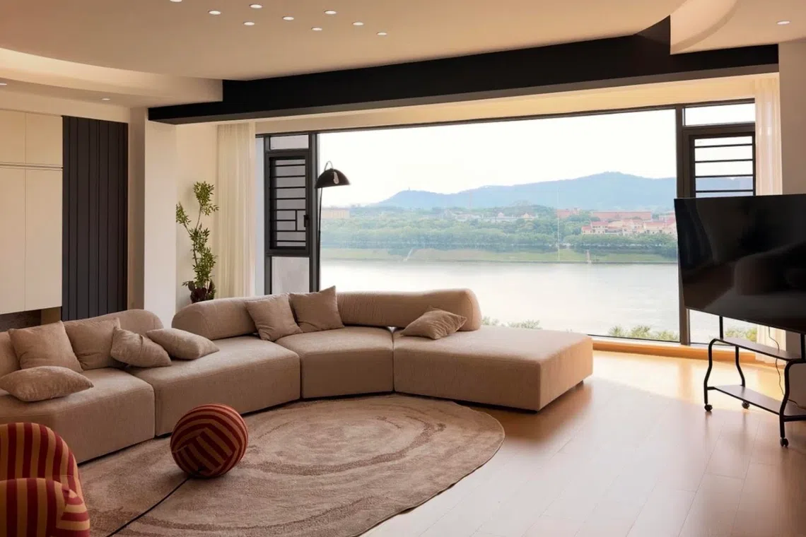 The living room of a river-facing, four-bedroom unit at Skyfame Byland. The unit is not known to be linked to the alleged pyramid schemes involving Singaporeans.