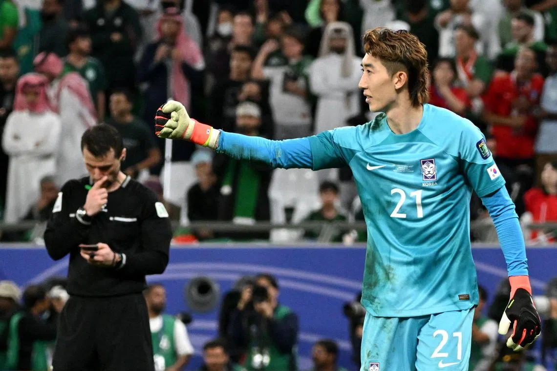 South Korea goalkeeper Jo Hyeon-woo gestures to his teammates during the Asian Cup last-16 clash with Saudi Arabia.
