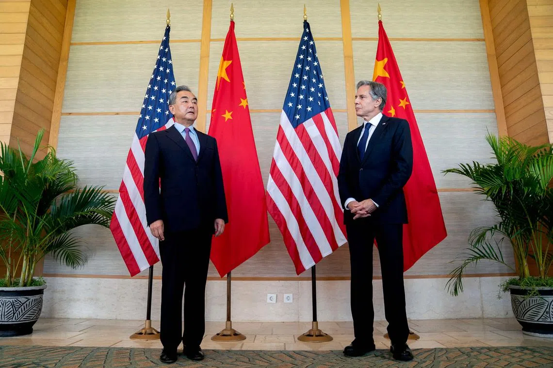 US Secretary of State Antony Blinken (right) and China's Foreign Minister Wang Yi attend a meeting in Nusa Dua.
