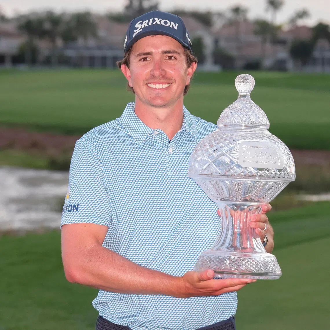 Nico Echavarria holds the champions trophy after winning the Cognizant Classic golf tournament.