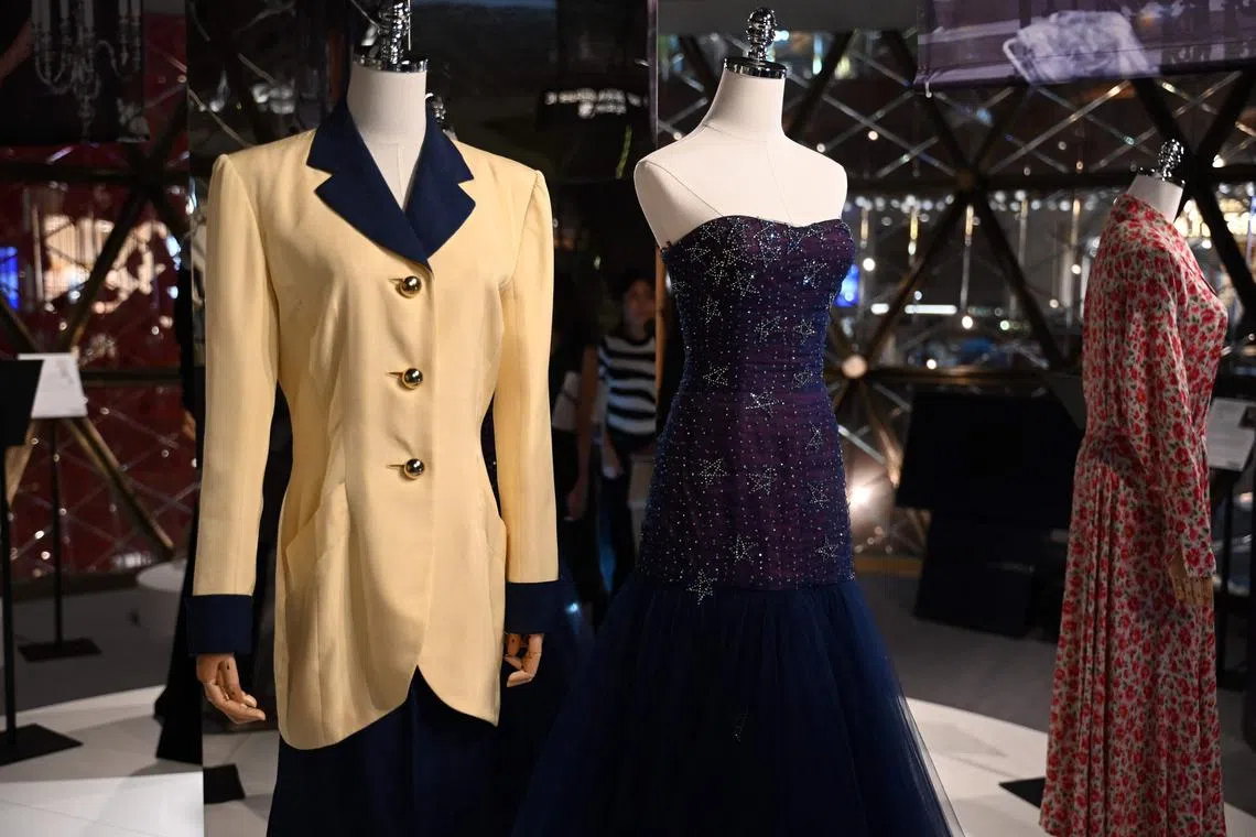 Outfits once worn by Princess Diana are shown during a media preview in Hong Kong ahead of an auction on June 27.