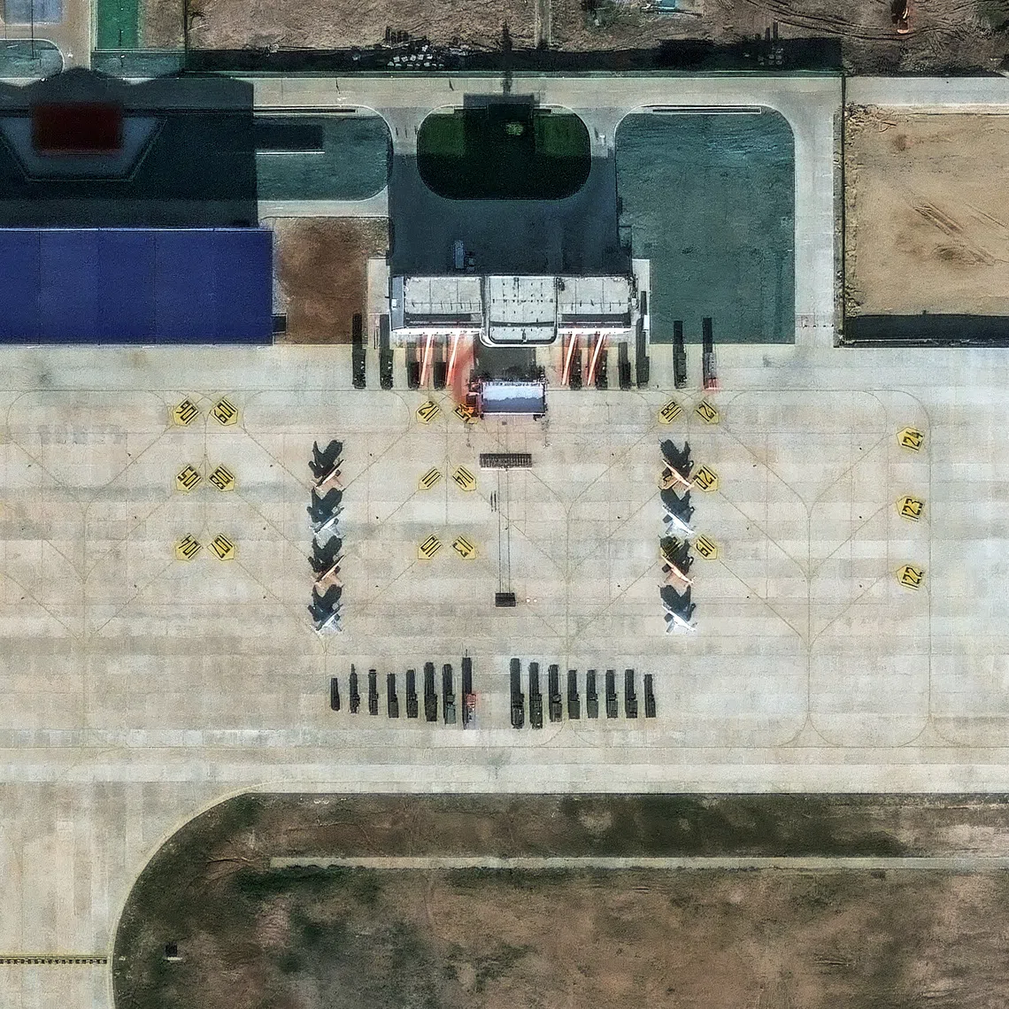 A satellite image showing what security analysts believe are Y-8 light attack fighters and support vehicles at a new China-Laos joint training facility in Ban Keun on Sept 30.