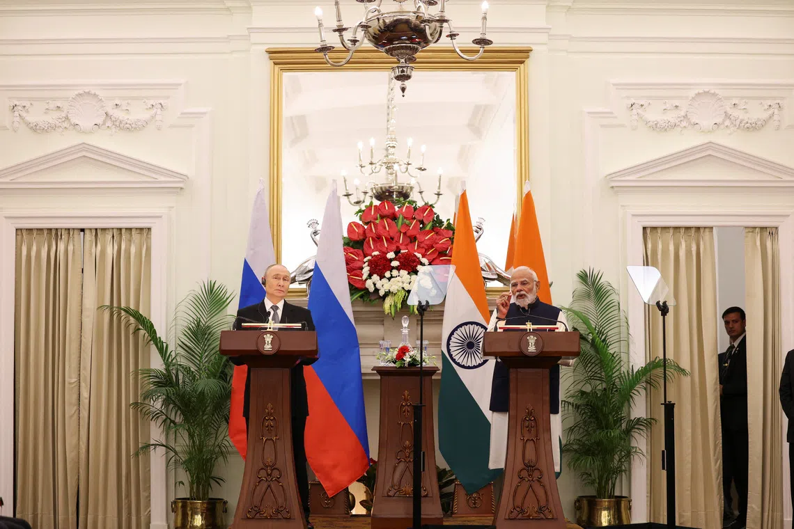 Russian President Vladimir Putin and India's Prime Minister Narendra Modi attend a presentation of a joint statement after their delegation level talks at Hyderabad House in New Delhi, India, December 5, 2025. REUTERS/Adnan Abidi