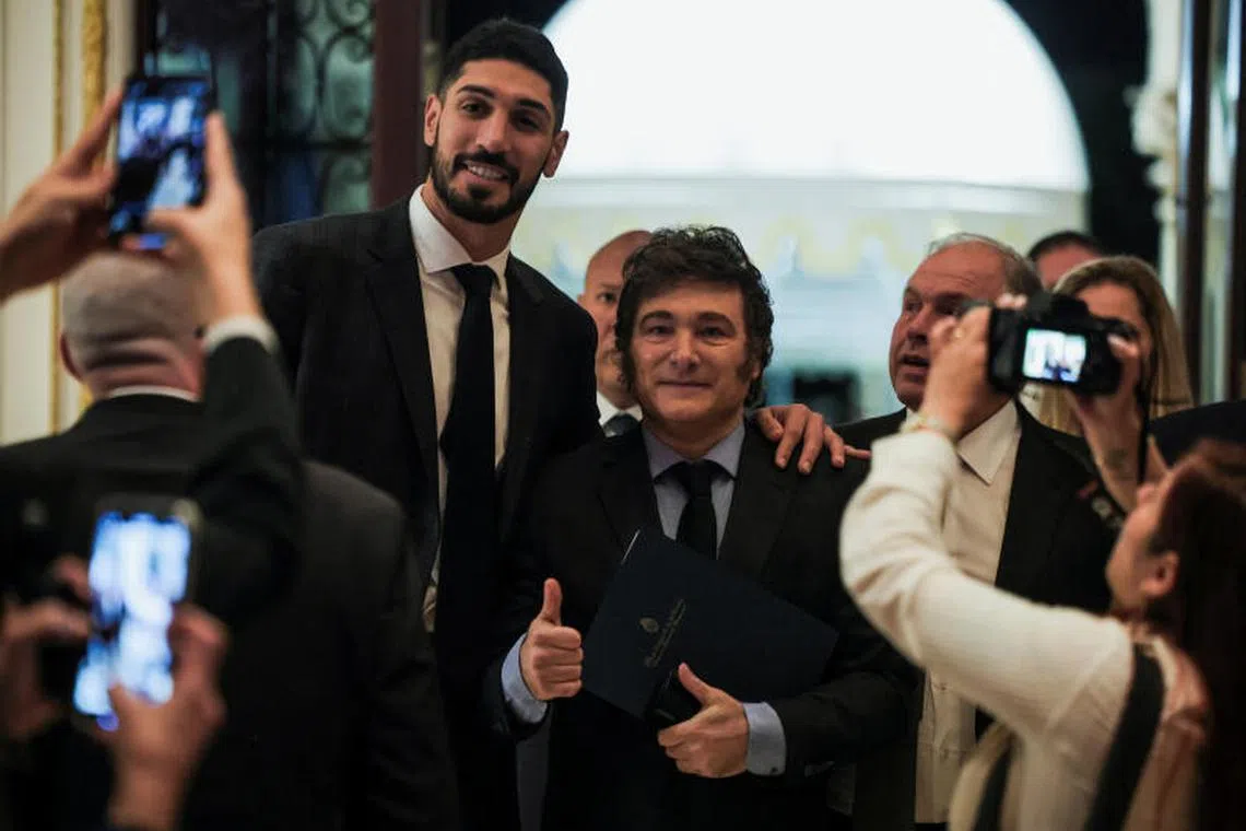 Argentine President Javier Millei poses with former professional basketball player Enes Kanter at the America First Policy Institute (AFPI) gala at Mar-A-Lago in Palm Beach, Florida, U.S., November 14, 2024. REUTERS/Carlos Barria