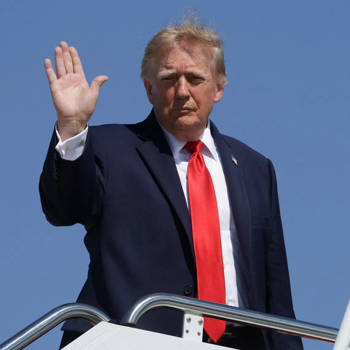 US President Donald Trump waves while boarding Air Force One, as he travels to Texas and Oklahoma, at Joint Base Andrews, Maryland, US, October 1, 2026. REUTERS/Jonathan Ernst