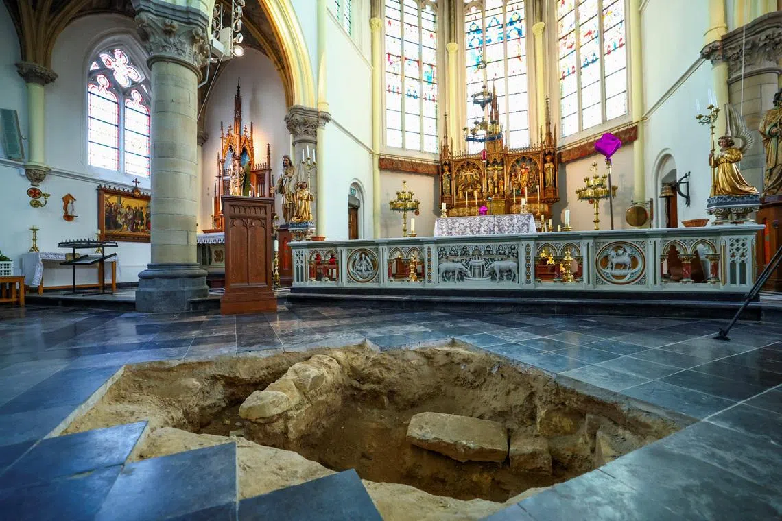 A view inside the Peter and Paul Church (Petrus en Pauluskerk) in Maastricht shows an excavation pit opened in the floor, where archaeologists believe they may have uncovered the skeletal remains of Charles de Batz de Castelmore, known as d’Artagnan, leader of King Louis XIV's musketeers, who died in 1673 during the French siege of the city, in Maastricht, Netherlands, March 25, 2026. REUTERS/Piroschka van de Wouw