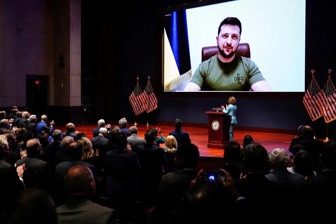 FILE PHOTO: Ukraine’s President Volodymyr Zelenskiy delivers a video address to senators and members of the House of Representatives gathered in the Capitol Visitor Center Congressional Auditorium at the U.S. Capitol in Washington, U.S., March 16, 2022. REUTERS/Sarah Silbiger/Pool/File Photo