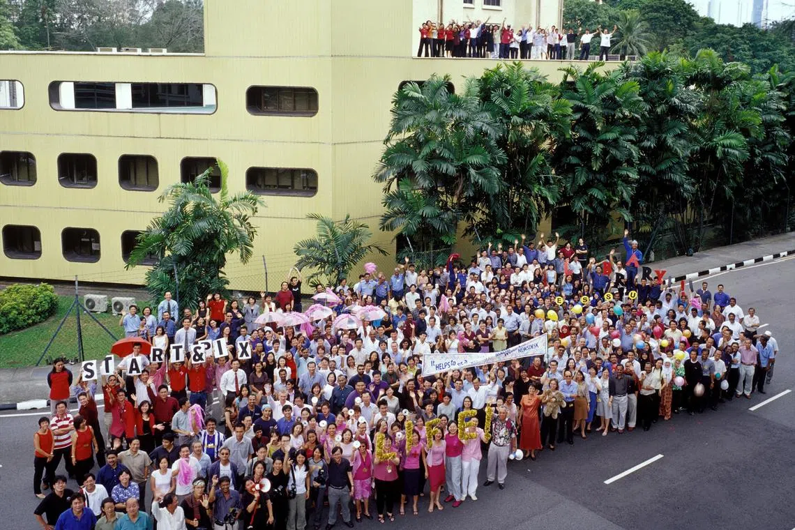 Times House staff gather for a final group photo at Kim Seng Road.