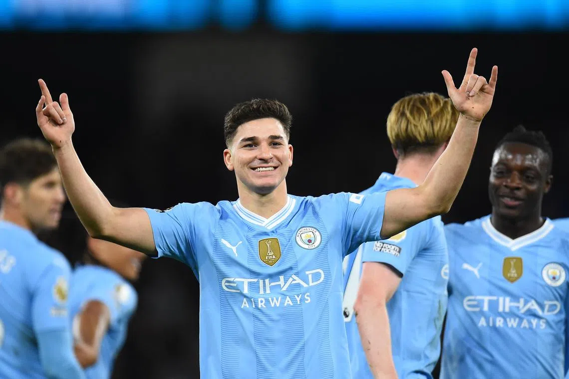Manchester City's Julian Alvarez (centre) celebrates after scoring his second goal.