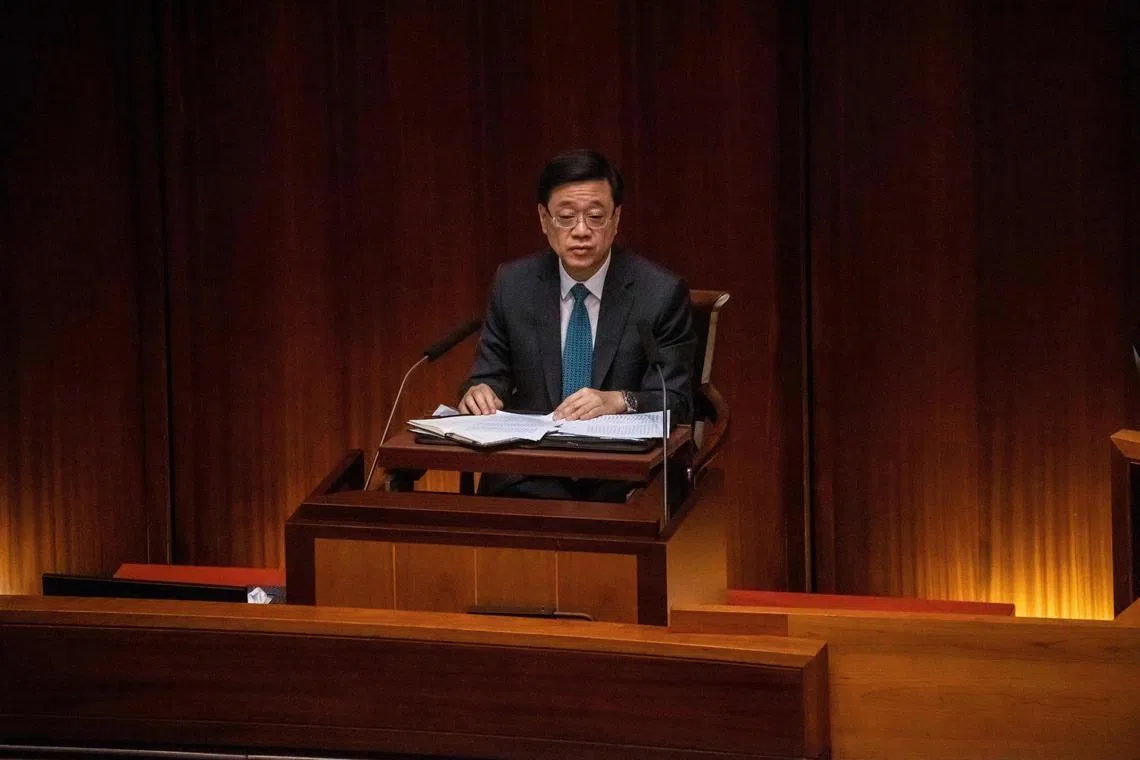 Hong Kong Chief Executive John Lee holds a question and answer session at the legislative council in Hong Kong on July 13, 2023, the last session before lawmakers break for the summer. (Photo by ISAAC LAWRENCE / AFP)