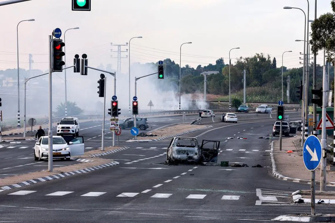 FILE PHOTO: A view of a junction shows the aftermath of a mass-infiltration by Hamas gunmen from the Gaza Strip, in the Sderot area, southern Israel October 7, 2023. REUTERS/Ammar Awad/File Photo
