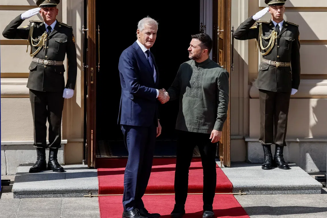 Ukraine’s President Volodymyr Zelensky greets Norway’s Prime Minister Jonas Gahr Stoere on Aug 23, before the Ukraine-Nordic-Baltic summit in Kyiv.