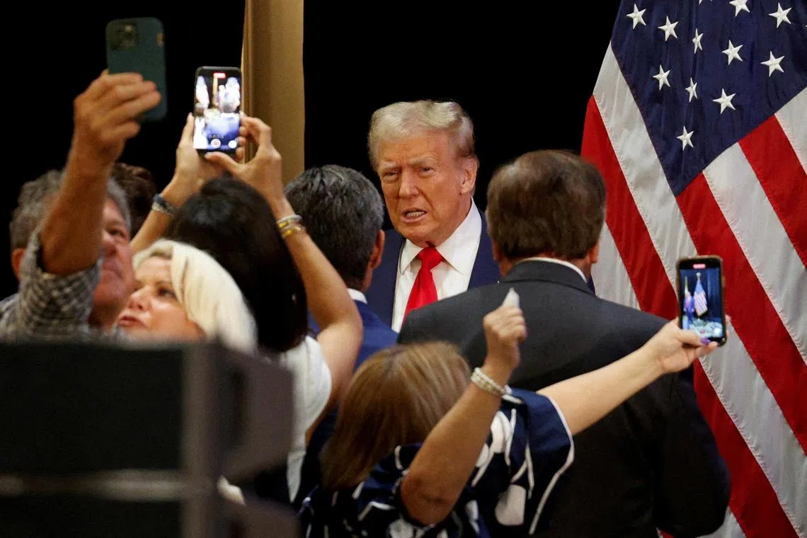 FILE PHOTO: Republican presidential nominee and former U.S. President Donald Trump attends a roundtable discussion with Latino community leaders in Doral, Florida, U.S. October 22, 2024.  REUTERS/Marco Bello  File Photo