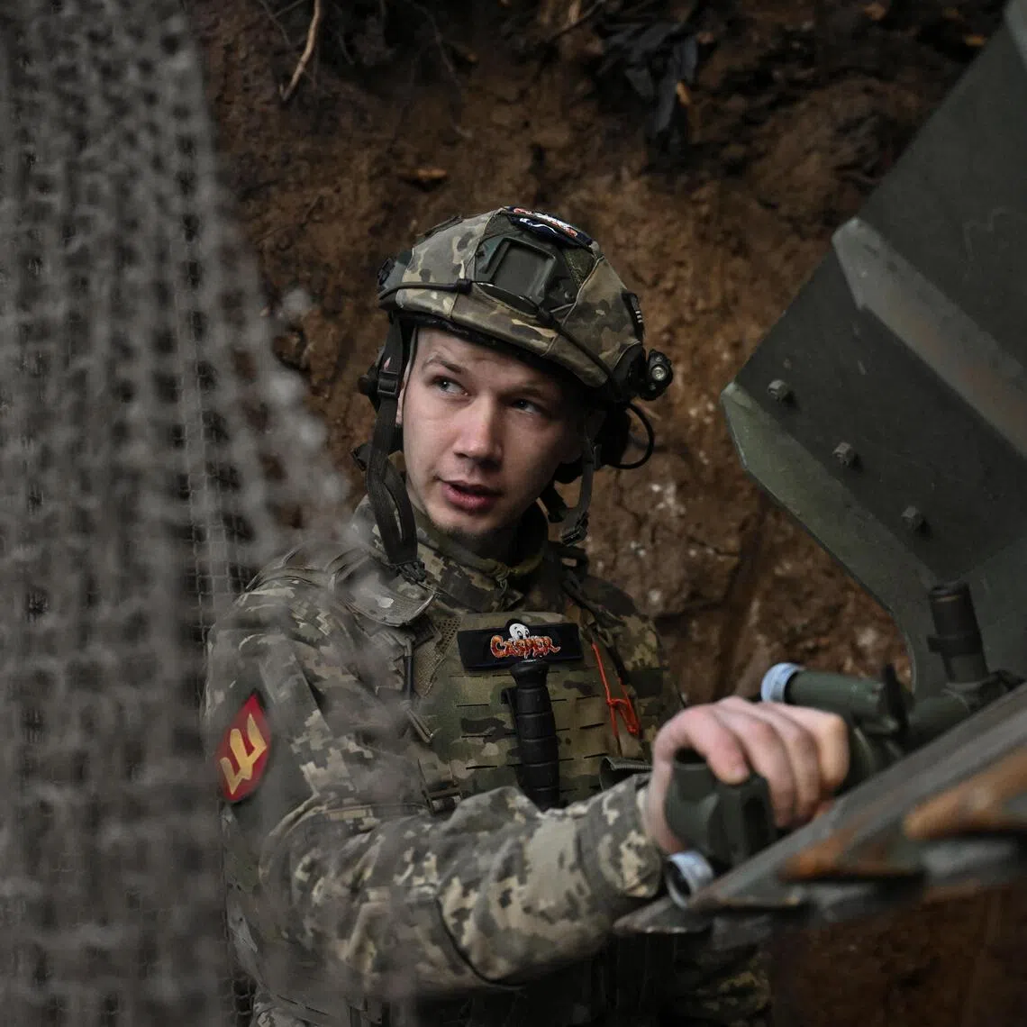 A Ukrainian serviceman preparing to fire towards invading Russian troops in Ukraine's  Zaporizhzhia region.