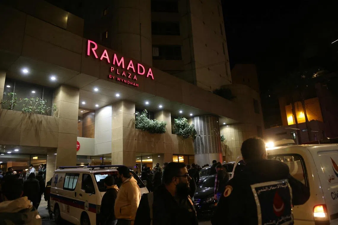 First aid responders gather at a Ramada hotel that was targeted by an Israeli strike, in Beirut’s seaside Rawche area, on March 8.