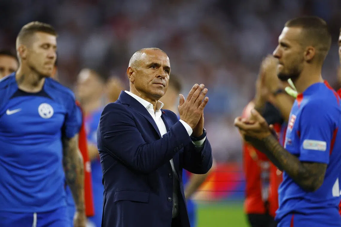 Soccer Football - Euro 2024 - Round of 16 - England v Slovakia - Arena AufSchalke, Gelsenkirchen, Germany - June 30, 2024 Slovakia coach Francesco Calzona looks dejected after the match REUTERS/John Sibley