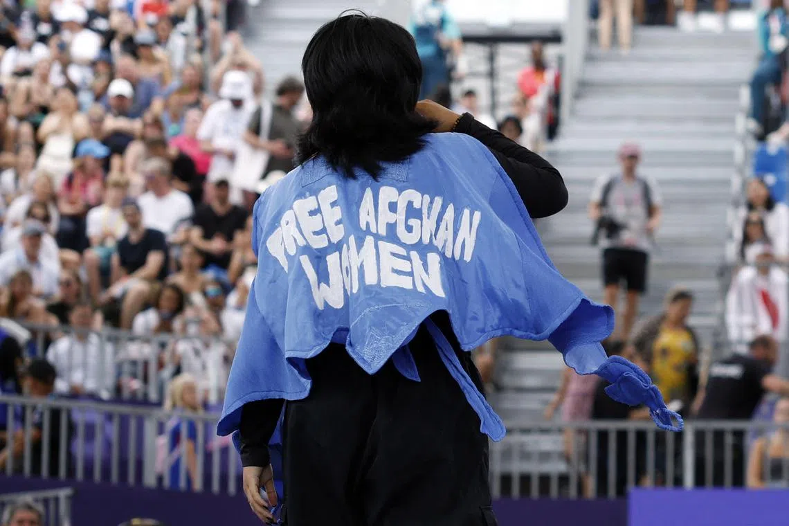 Refugee Olympic team's Manizha Talash wears a jacket reading "Free Afghan women" as she competes in the women's breaking qualifying round at the Paris Olympic Games at La Concorde on Aug 9, 2024.
