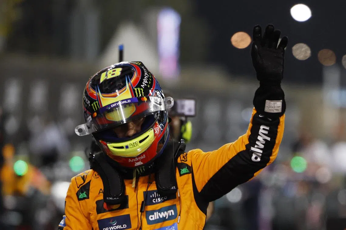 McLaren's Oscar Piastri celebrates after qualifying in pole position.