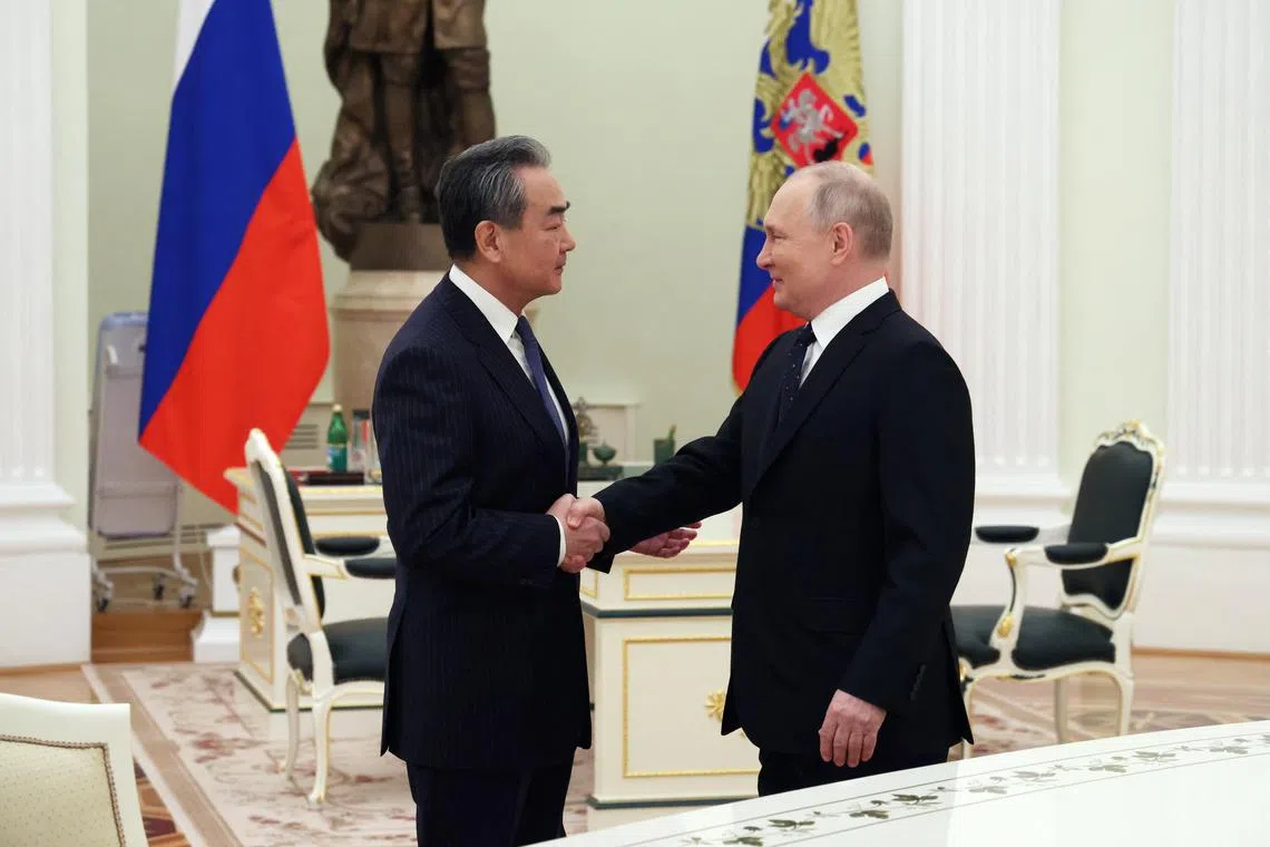 Mr Putin welcomed China’s top diplomat, Mr Wang Yi, to the Kremlin.