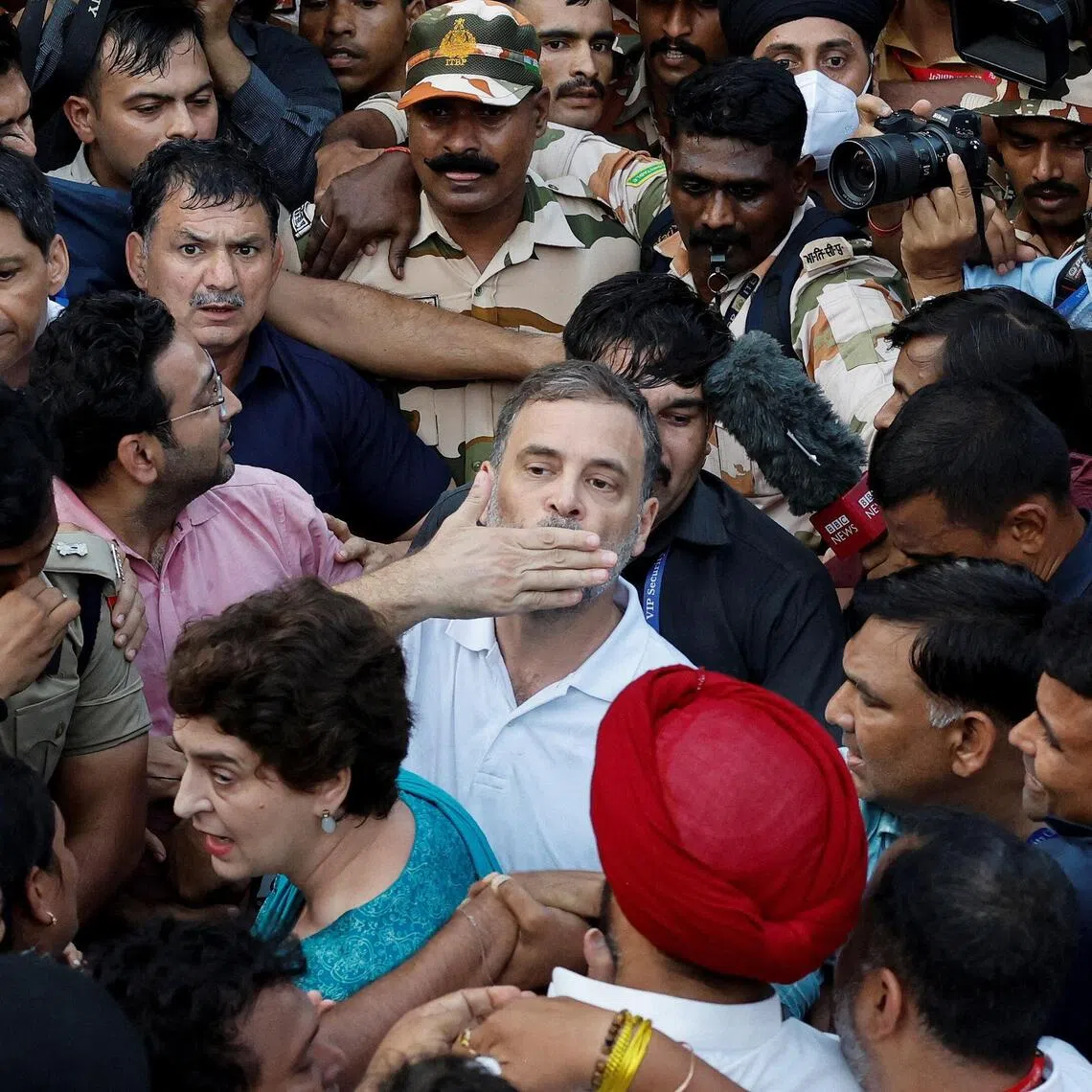 Police detaining Indian opposition leader Rahul Gandhi and his sister Priyanka Gandhi Vadra during a protest in New Delhi on Oct 7.