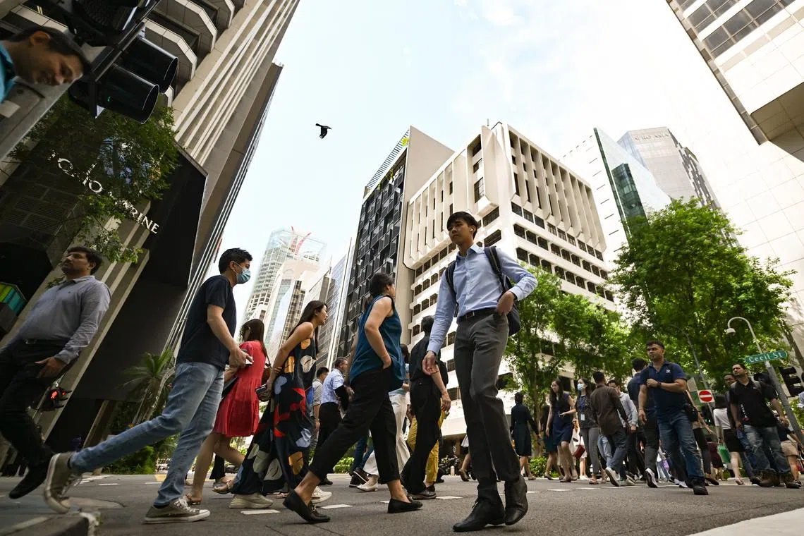 Office workers crossing Cecil Street near Bangkok Bank Building in the CBD area, 21 June 2023. population, workers, labour, workforce, manpower, financial district  