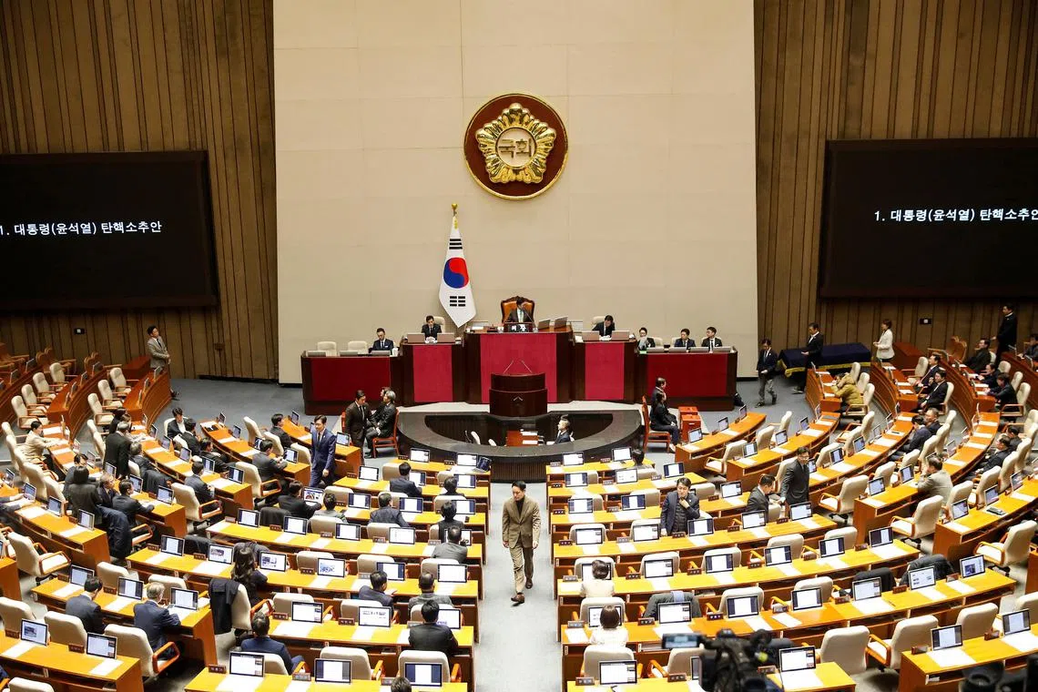 South Korean lawmakers casting their votes for the impeachment of President Yoon Suk Yeol at the National Assembly in Seoul on Dec 14.