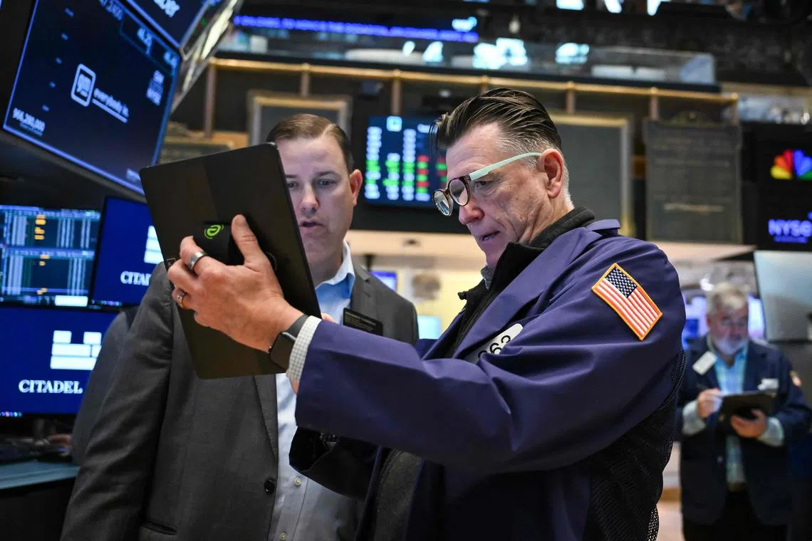 Traders working on the floor of the New York Stock Exchange, at the opening bell in New York on April 29.