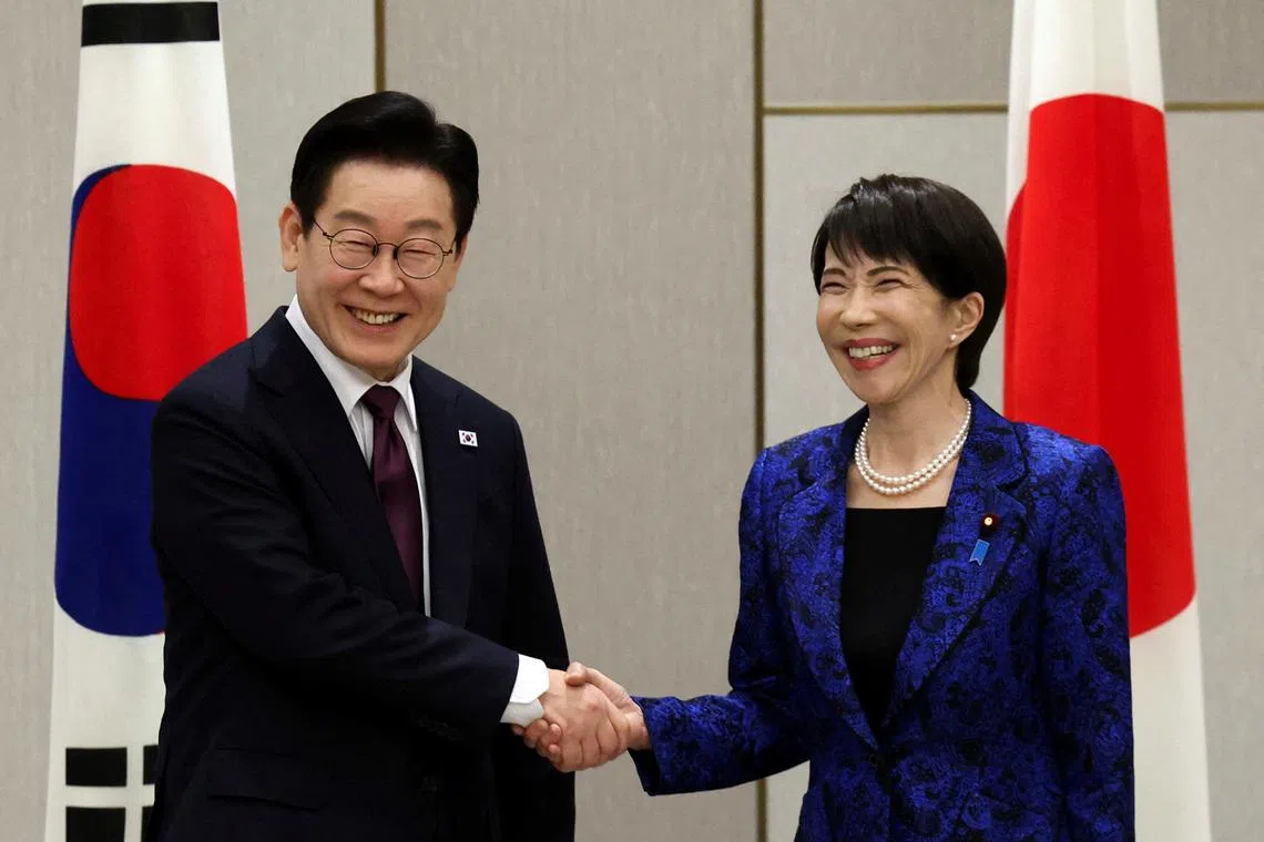 Japan's Prime Minister Sanae Takaichi shakes hands with South Korea's President Lee Jae Myung at the start of their summit meeting in Nara, western Japan January 13, 2026.  REUTERS/Issei Kato/Pool