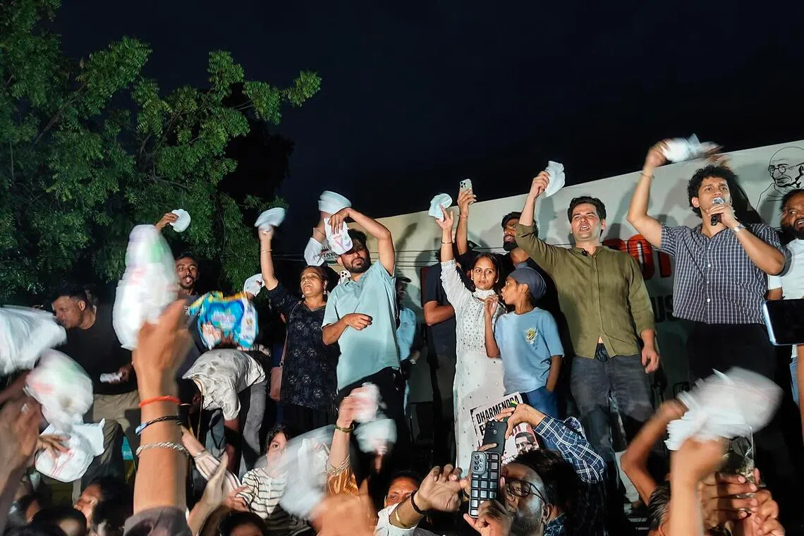 Abhijeet Dipke and other representatives of the Cockroach Janta Party holding diapers at a protest in New Delhi on June 23 against exam paper leaks. Credit: Debarshi Dasgupta