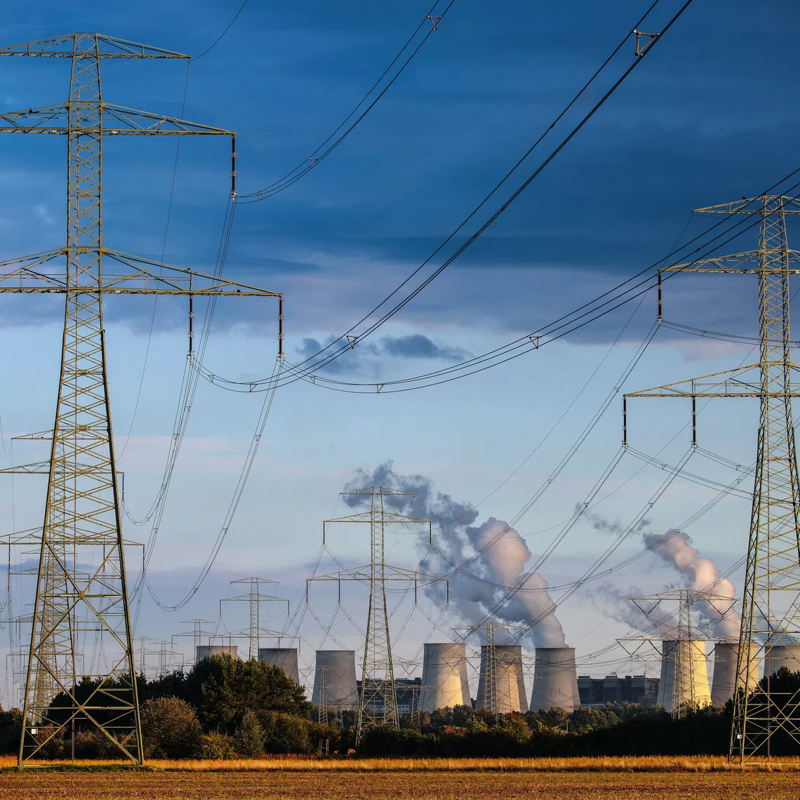 Power lines are seen in front of the Janschwalde power plant in Turnow-Preilack, Germany.