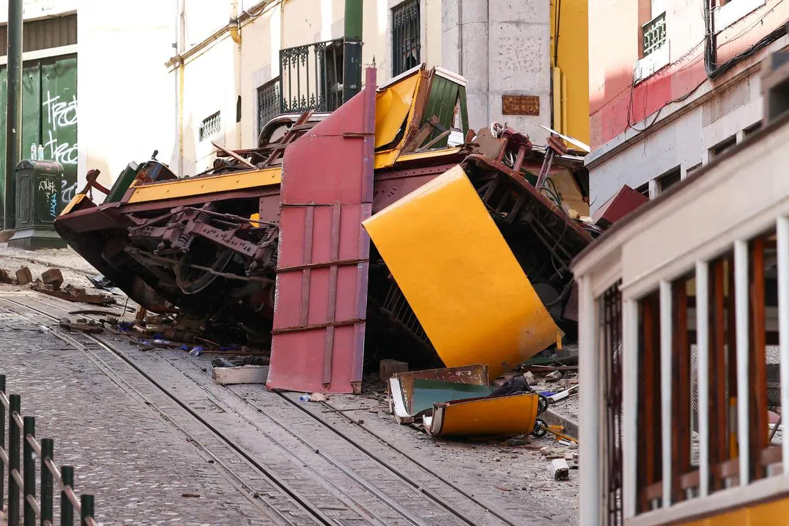 A view shows the site of the accident after Gloria funicular railway car, a popular tourist attraction, derailed and crashed, resulting in multiple casualties, according to authorities, in Lisbon, Portugal, September 4, 2025. REUTERS/Pedro Nunes